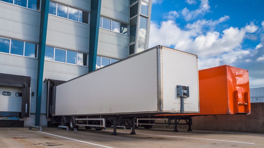 Colored truck trailers loading