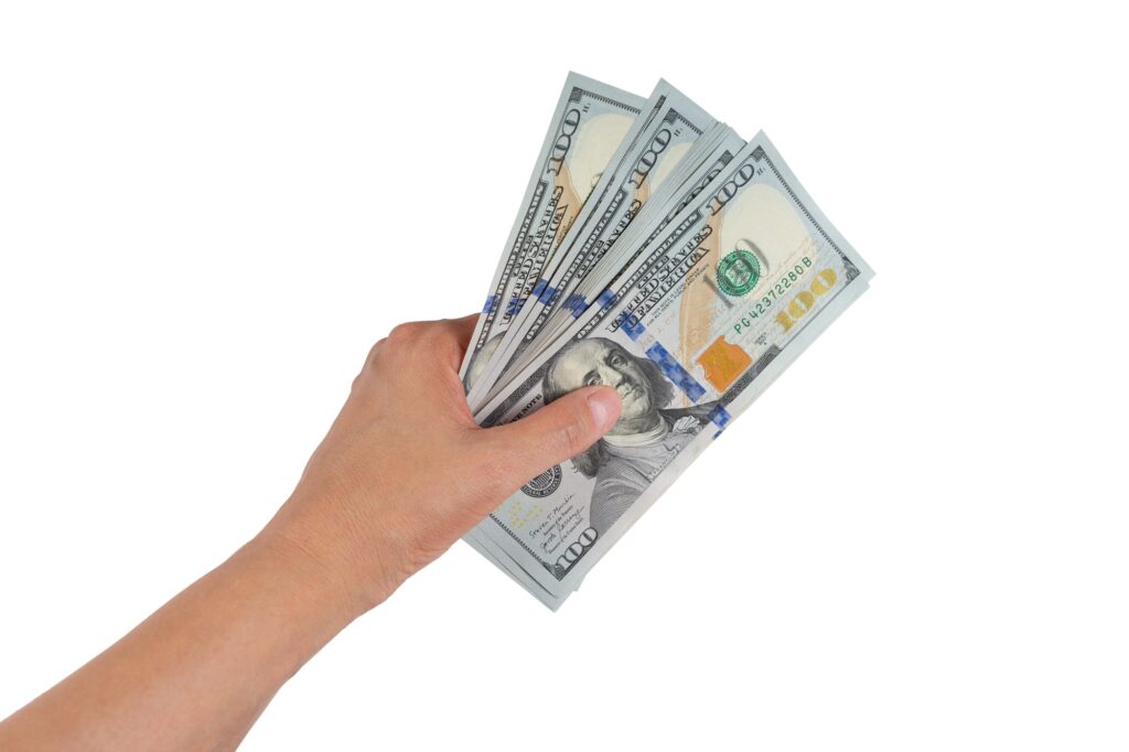 Woman Hand With Dollar Cash Isolated On White Background