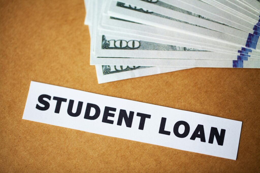 Credit concept. Student loan written on white card
